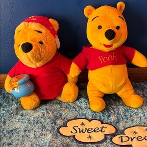 2 plush Pooh bears by Disney